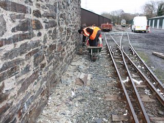Cleaning mortar by the Goods Shed
