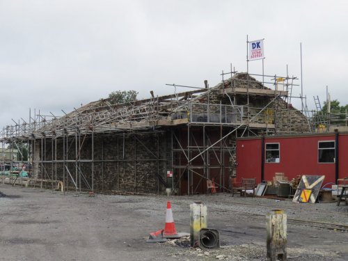 Lots of scaffolding surrounds the building Lots of scaffolding surrounds the building