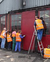 Kids Training week repairing and painting the loco shed doors