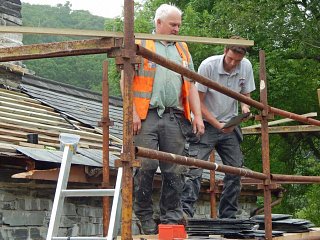Peter Hughes and Richard Thomas repairing the roof