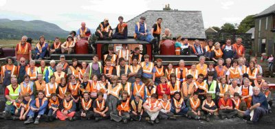 Kids' Training Week group pose round one of the railway's locomotives